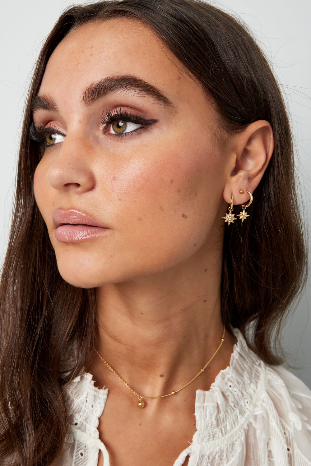 Orecchini stella con pietre - Colore oro/bianco h5Immagine2